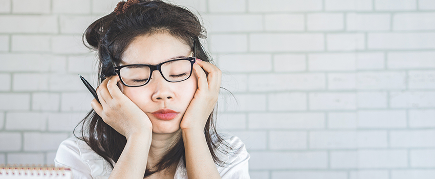 A woman on the computer falling asleep