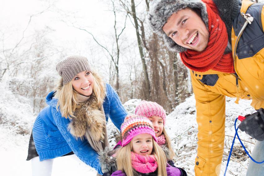 Happy family in the winter wonderland