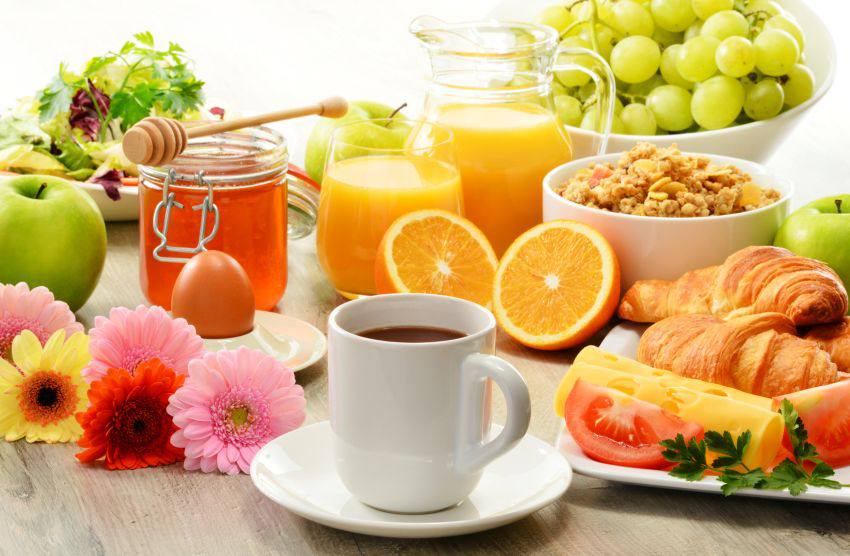 A cup of coffee surrounded by healthy products