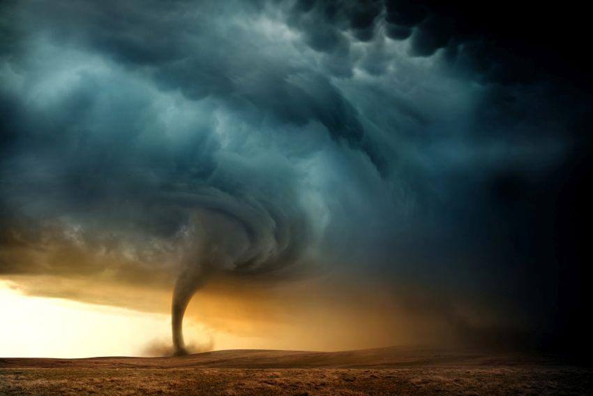 A tornado forming in the middle of the desert