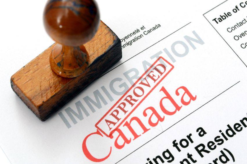 Canada immigration form with Approved stamp on it