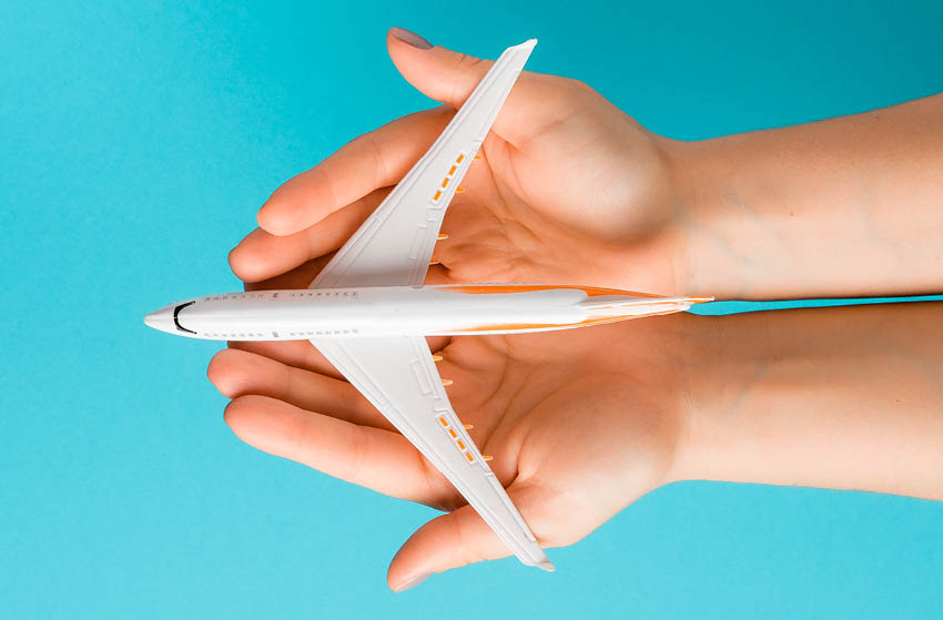 A toy plane in hands