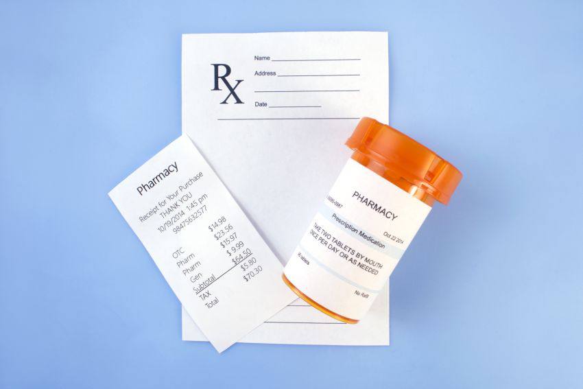 A bottle of pills with a paper for their prescription