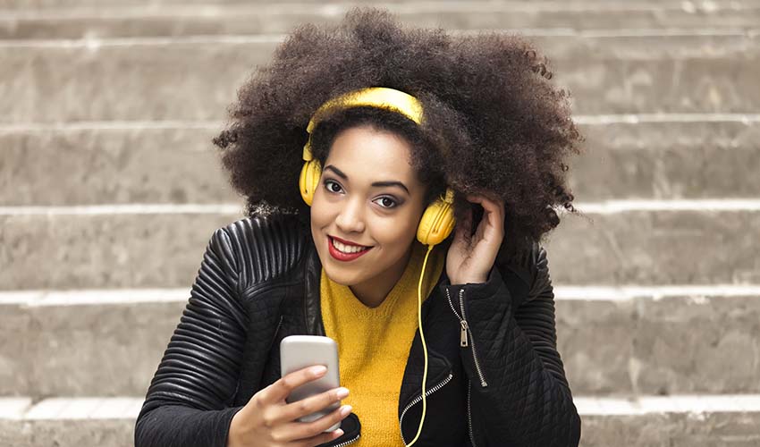 Woman listening to music with her headphones