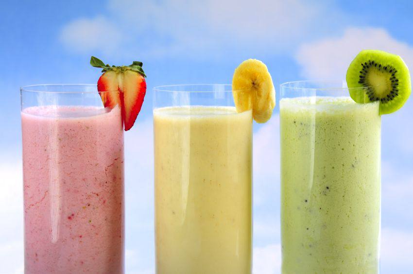 Three protein drinks flavored with strawberry, banana and kiwi