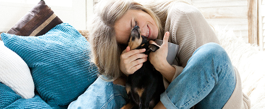 Woman hugging her dog