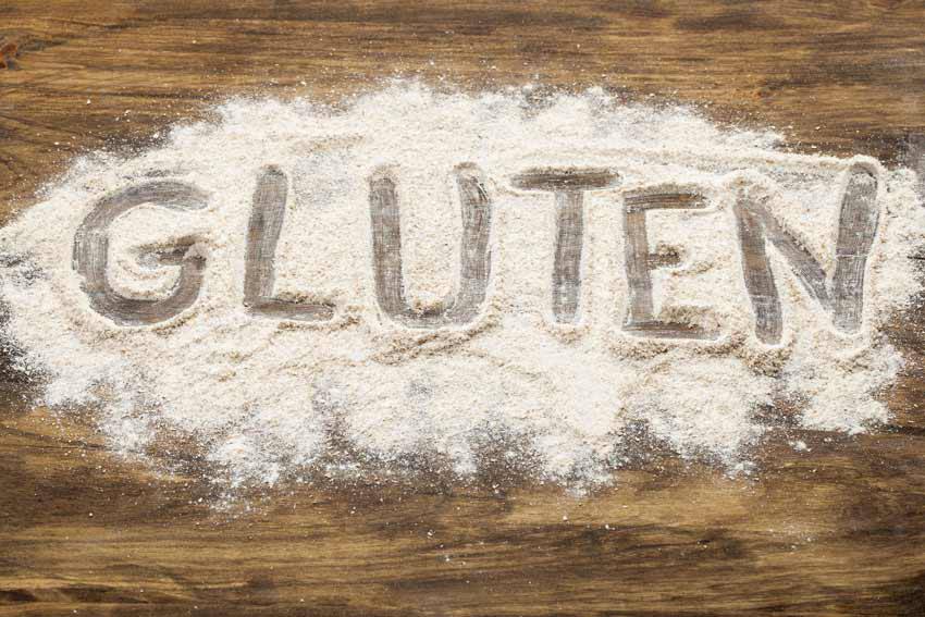 The word "GLUTEN" written in flour