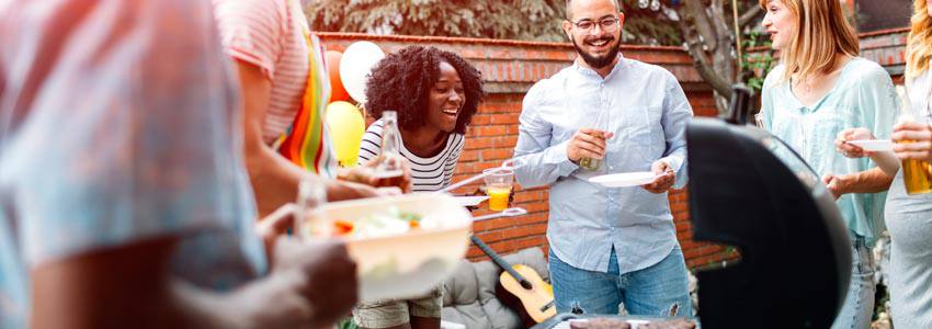 A group of people enjoying a barbecue party