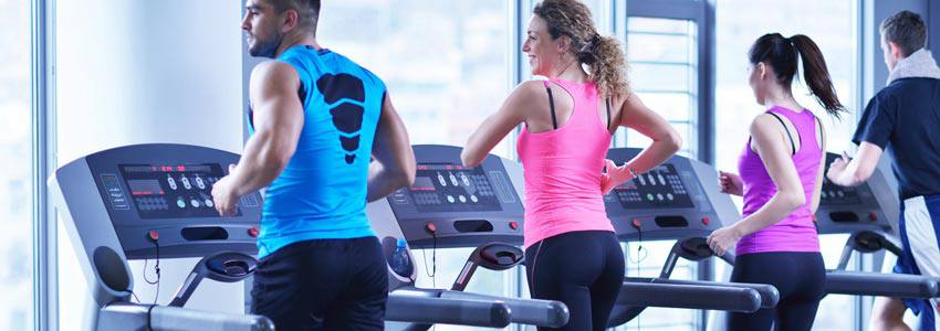 Adults exercising on a treadmill