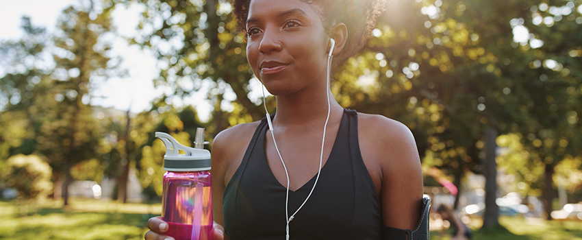 A woman working out with a bottle of water