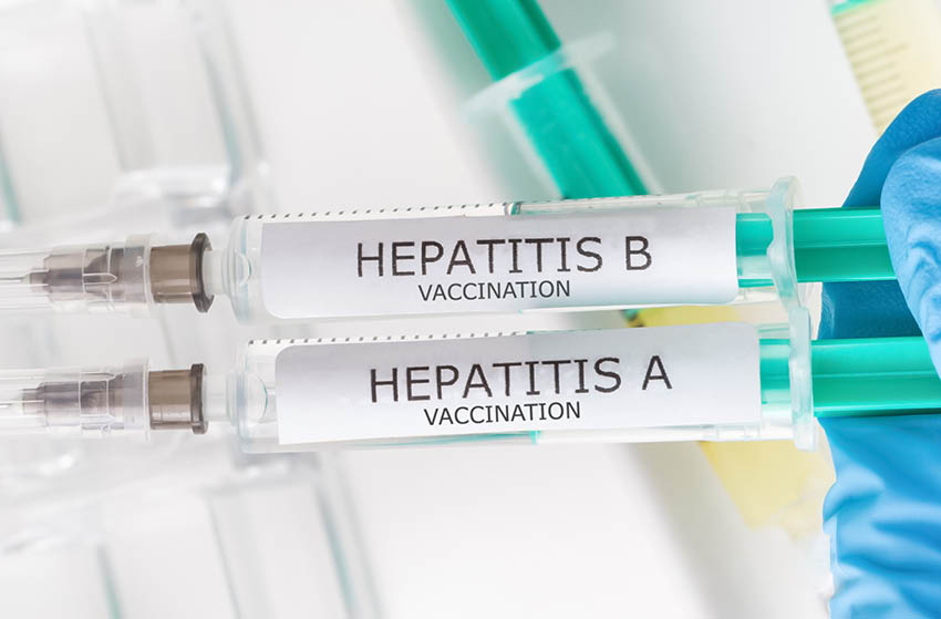 Two syringes written "HEPATITIS A" and "HEPATITIS B" 