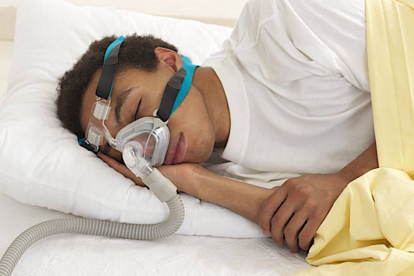 A man sleeping with a device on his nose