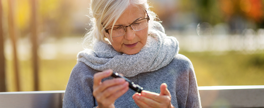 A woman checking her blood sugar level