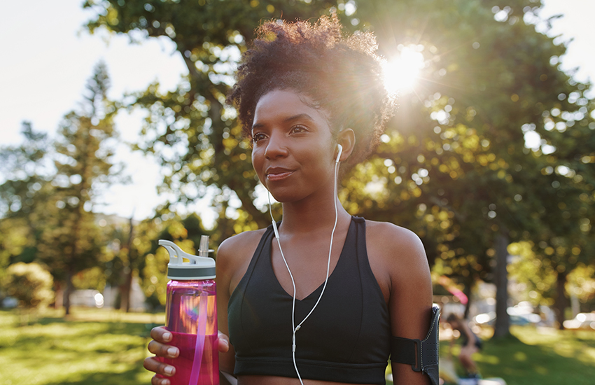 A woman working out with a bottle of water