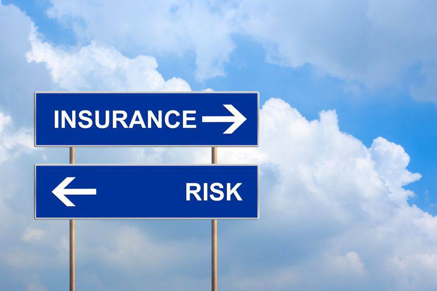 A board marked "Insurance" and another one marked "Risk"