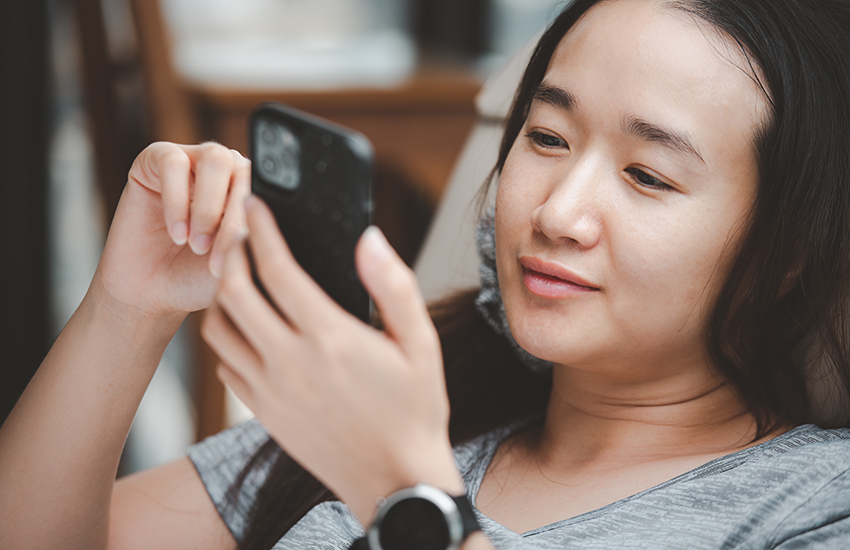  Young woman happy on her phone