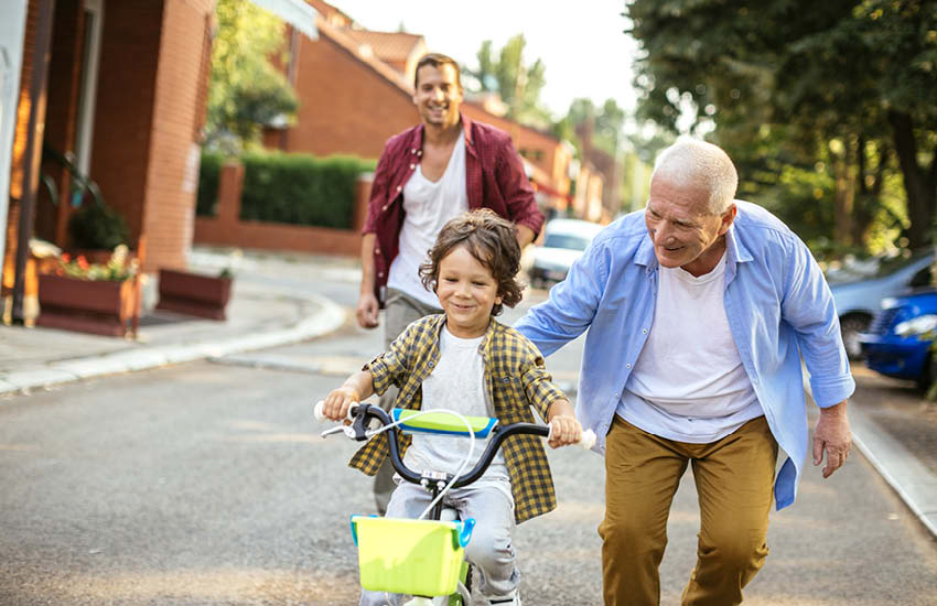 A child learns to ride a bicycle