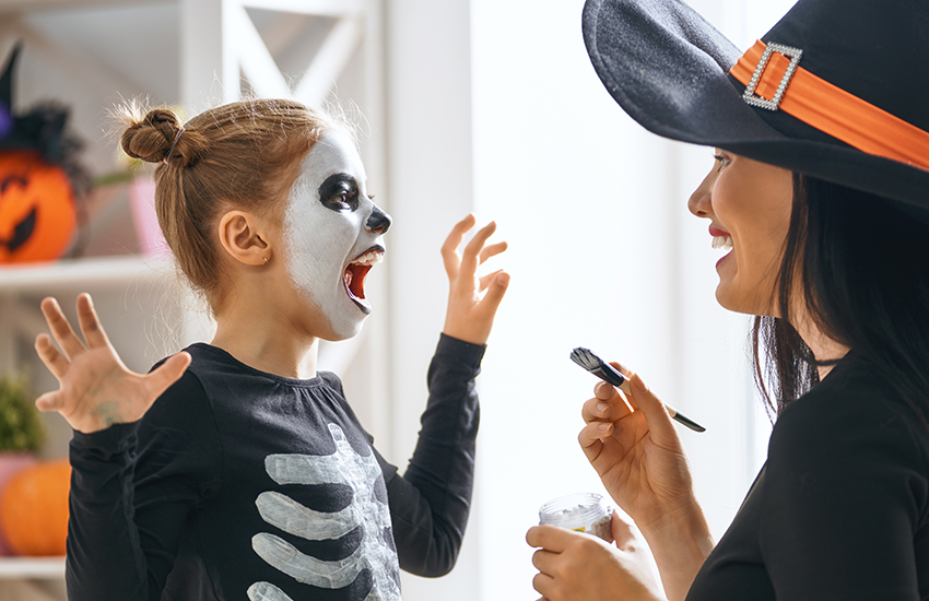 Kid dressing up for Halloween