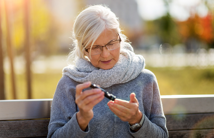 A woman checking her blood sugar level