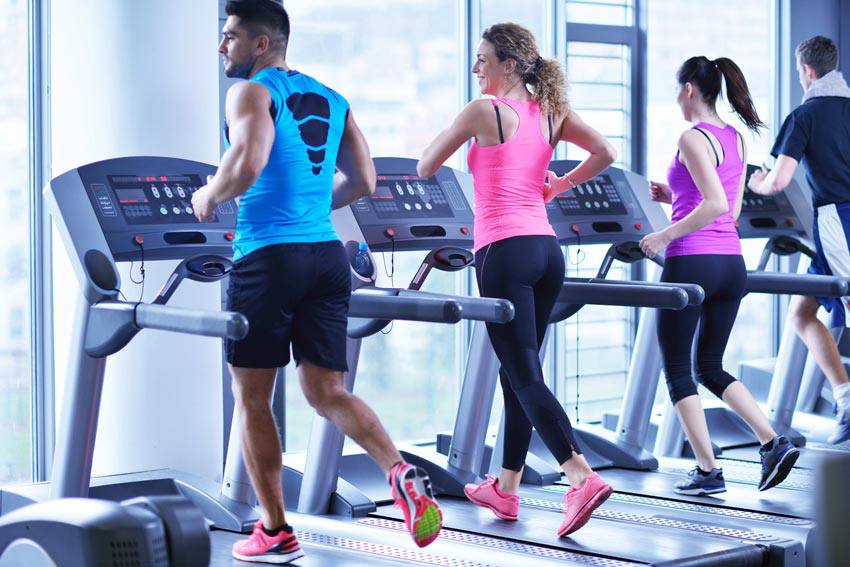 Adults exercising on a treadmill