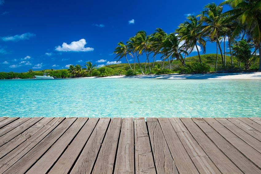 A beautiful beach with light blue water 