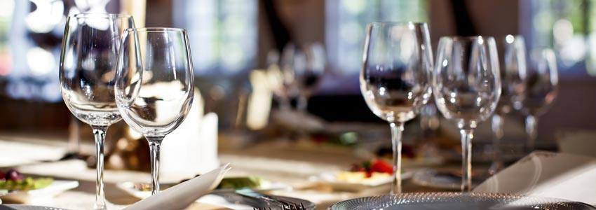 A table full of dinner plates and glasses