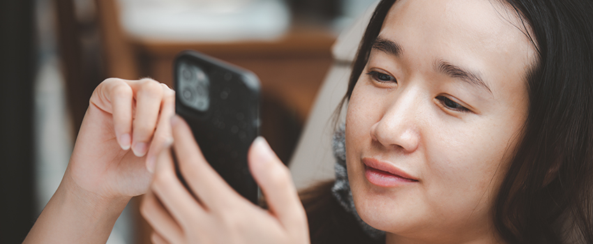  Young woman happy on her phone